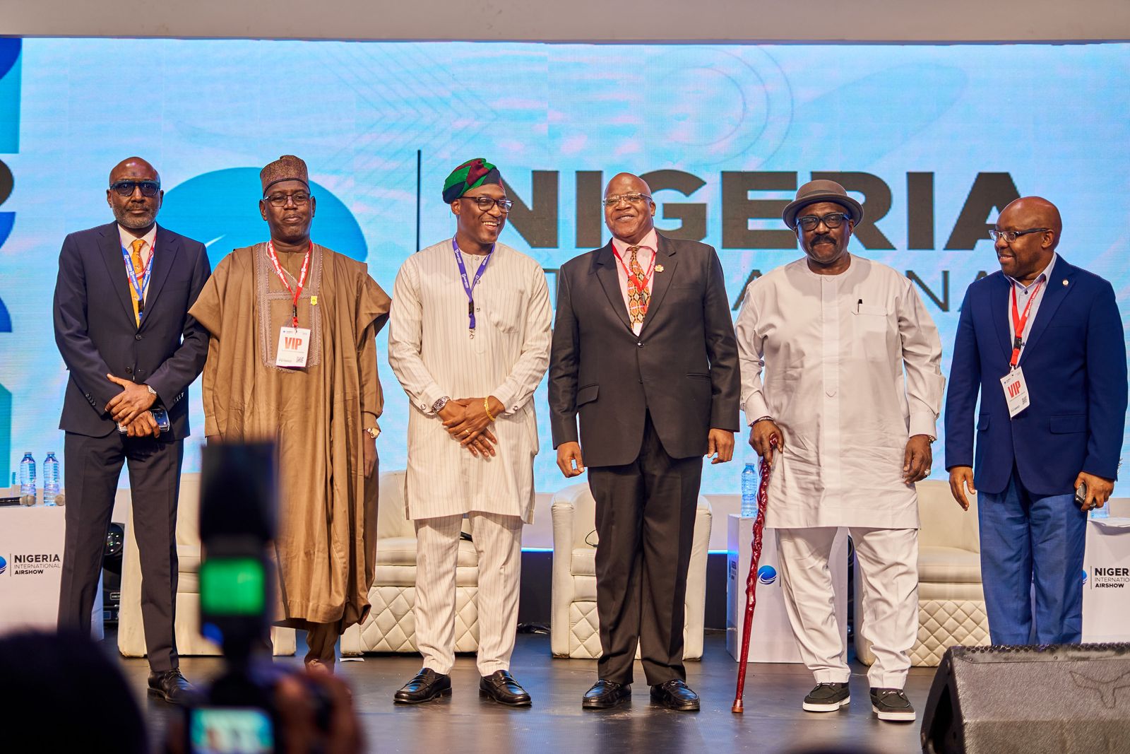 Six Nigerian industry leaders standing together on stage at the Nigeria International Airshow